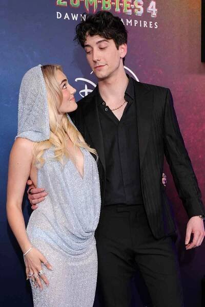 Meg Donnelly, Milo Manheim at the "ZOMBIES 4: Dawn of the Vampires" Premiere held at El Capitan Theatre on July 08, 2025 in Los Angeles, California. 