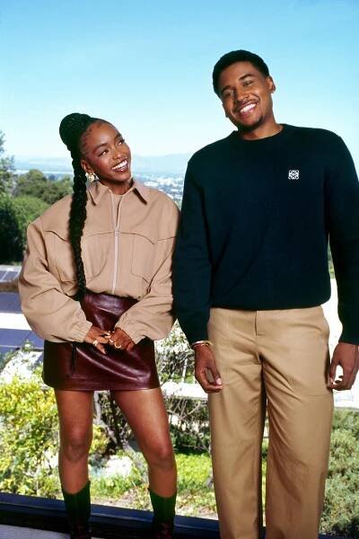 Lovie Simone and Michael Cooper smiling against the backdrop of Los Angeles.