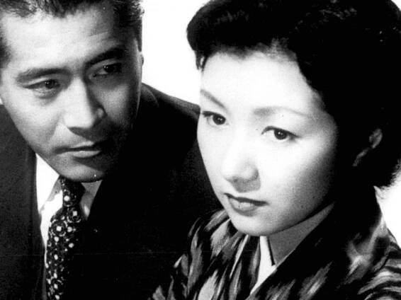 a close-up of Mifune Toshiro looking inquisitively at Takamine Hideko who seems worried