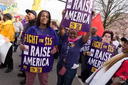 Group of SEIU protestors, demanding a $15 minimum wage. The Fight for 15 is a great prompt for a persuasive essay.