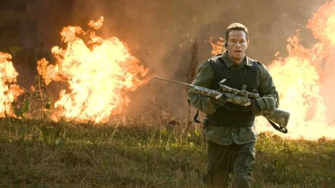 Mark Wahlberg as Bob, undeterred by the fire roaring behind him in Shooter