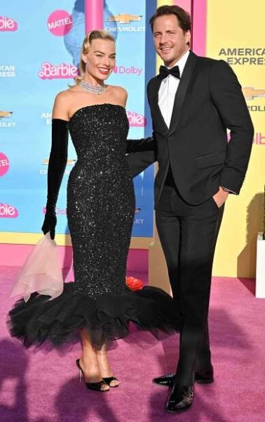 Australian actress Margot Robbie and her husband British producer Tom Ackerley arrive for the world premiere of "Barbie"