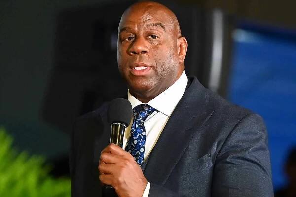 Magic Johnson speaks during the 2023 International Poverty Forum at Delta Flight Museum on March 17, 2023 in Atlanta, Georgia.