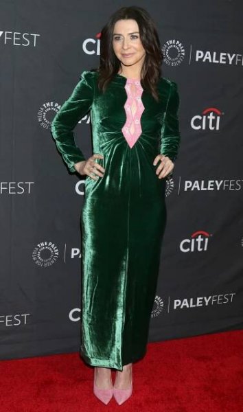 Caterina Scorsone dazzles in a green velvet dress with pink accents, paired with matching pink heels, at PaleyFest LA