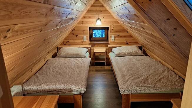a cabin with two beds in the attic at Chalupa u Uhříků in Rajnochovice