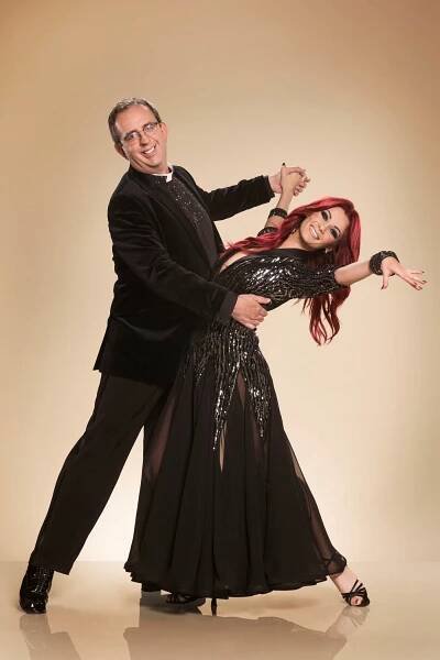 Richard Coles & Dianne Buswell in ballroom dance pose