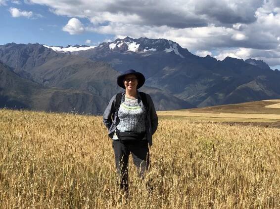 Laura Davis standing in front of a mountain range