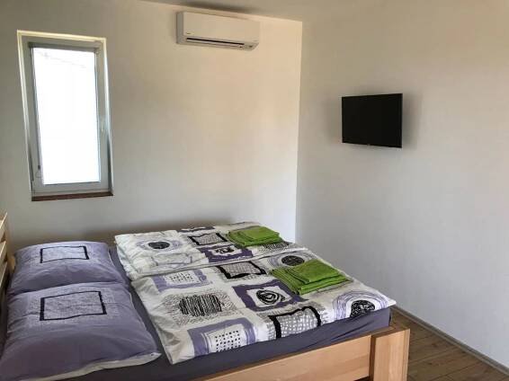 Posteľ alebo postele v izbe v ubytovaní Apartmány Přítluky