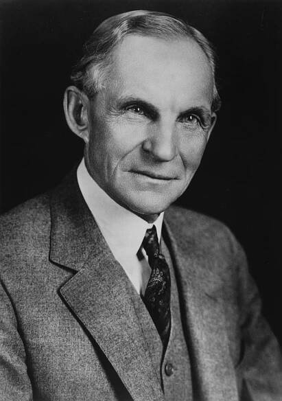 an old black and white photo of a man in a suit