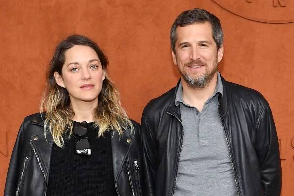 Marion Cotillard and Guillaume Canet attends the 2019 French Tennis Open - Day Fithteen at Roland Garros on June 09, 2019 in Paris, France. 