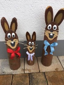 three brown rabbits made out of toilet paper