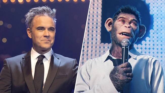 Robbie Williams wears a suit under stage lights; a CGI chimp in a shirt and tie sings into a mic in a still from 'Better Man'