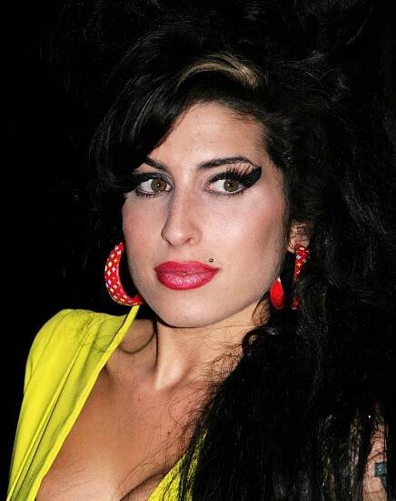 Amy Winehouse arrives at the BRIT Awards 2007 in association with MasterCard at Earls Court on Feb. 14, 2007, in London.