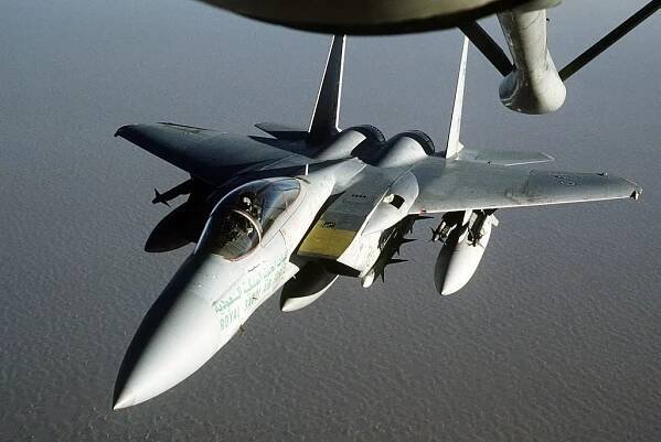 An RSAF F-15 approaches a KC-135 for refueling during Operation Desert Shield.