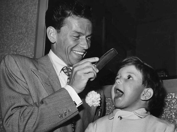 Frank Sinatra and Frank Jr. on the set of 'It Happened in Brooklyn'. 