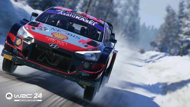 An image of the Hyundai i20 Coupe WRC rally car, driving at full speed through a snowy Swedish forest.