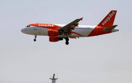 An easyJet Airbus A319 plane prepares to land at Lisbon's airport