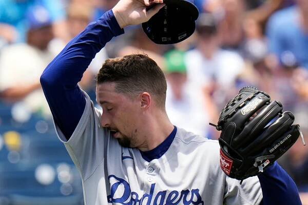 Los Angeles Dodgers pitcher Blake Snell wipes forehead as he works against the Tampa Bay Rays during the second inning of a baseball game Saturday, Aug. 2, 2025, in Tampa, Fla.