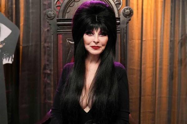 CASSANDRA PETERSON as legendary Elvira, Mistress of the Dark THE GOLDBERGS