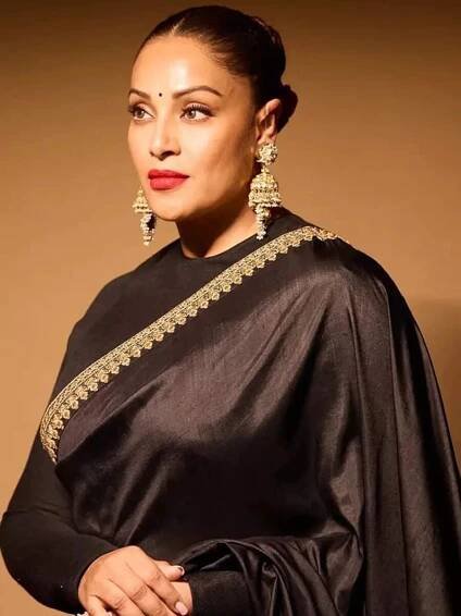Bipasha Basu captivates in a timeless black satin saree