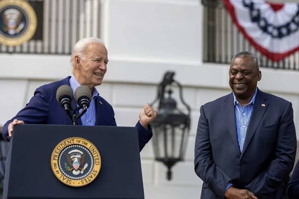 President Joe Biden speaks as Secretary of Defense Lloyd Austin listens on the south lawn on July 04, 2023 in Washington, DC. 