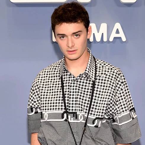 Half-Body Photo Of Noah Schnapp At Milan Wallpaper