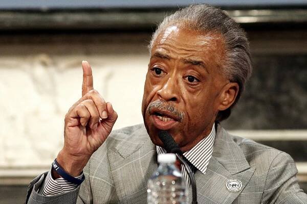 Rev. Al Sharpton (here at a July 31 roundtable with Mayor Bill de Blasio and Police Commissioner Bill Bratton) says he's headed to St. Louis after the shooting death of unarmed Michael Brown, 18, at the hands of police.