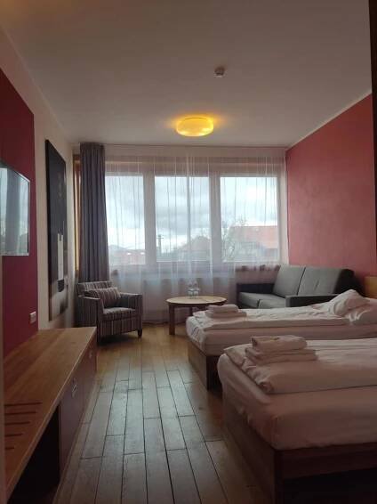 Postel nebo postele na pokoji v ubytování Hotel Madl
