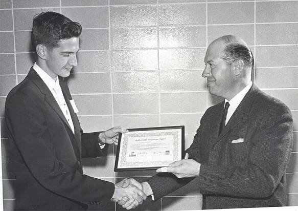 Jim Greene accepts another award for outstanding sales and service early in his career