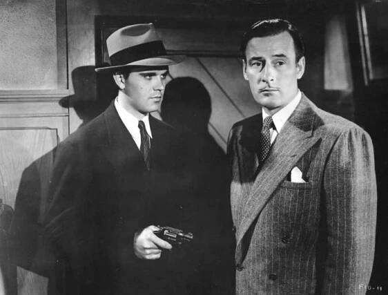 A publicity shot for The Falcon in Danger (1943), Conway’s third outing as Tom Lawrence.