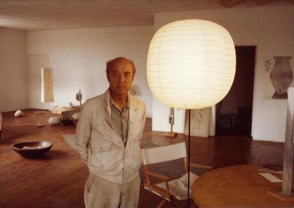 Isamu Noguchi in Long Island City with his sculptures