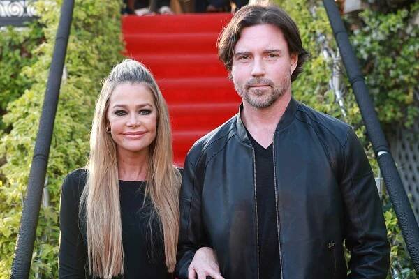 Denise Richards and Aaron Phypers attend the "Paper Empire" Tv Show Event at Annex Beach on April 18, 2023 in Cannes, France