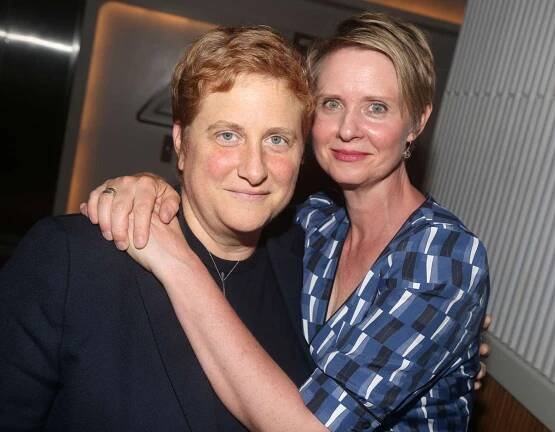 Christine Marinoni and wife Cynthia Nixon pose at the opening night after party for The New Group Theater production of 