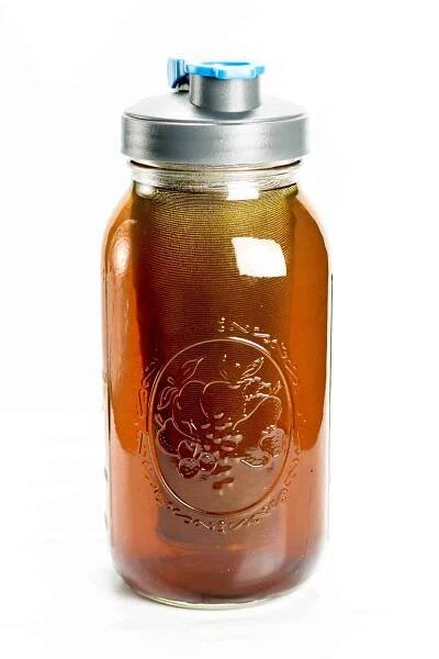 Coffee is cold brewed in a jar.