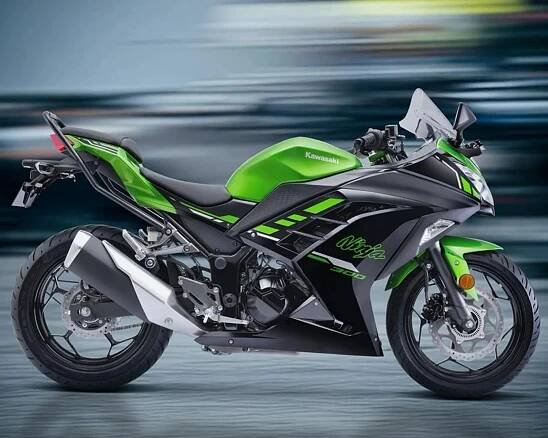Green and black Kawasaki Ninja 300 sport motorcycle with aerodynamic fairings, disc brakes, and a sleek exhaust system.