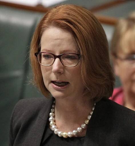 Julia Gillard who appears quite emotional addresses the chamber at Parliament House. - click to view larger image