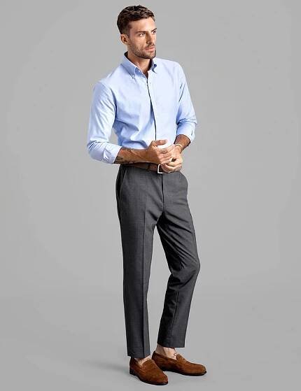 light blue button-down shirt, grey pants, and brown suede loafers