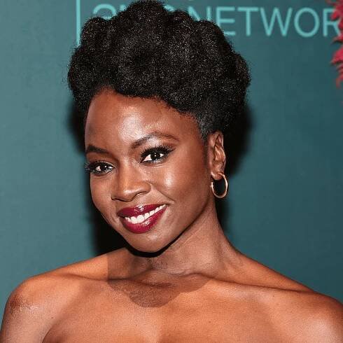 Danai Gurira with elegant updo and natural textured hair, zoomed in