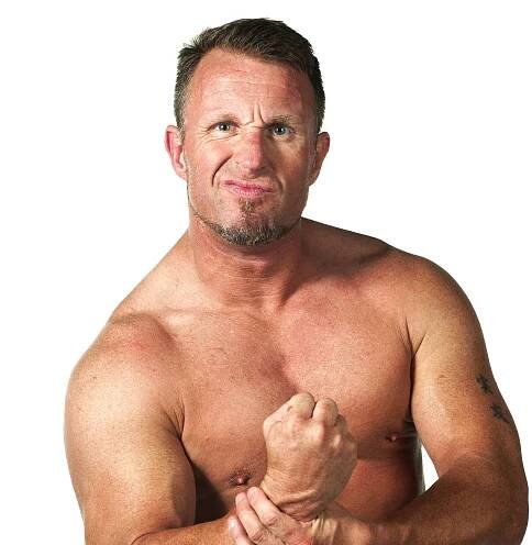 Wrestler Doug Williams Flexing His Muscles Wallpaper