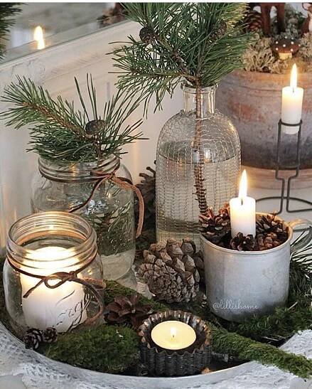 christmas decorations with candles and pine cones