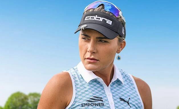 Lexi Thompson wearing shirt with Empower logo