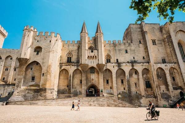 Avignon, France – June 27, 2015: People Walking Near Ancient Pop