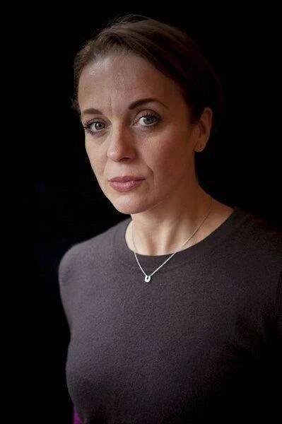 a woman is looking at the camera with an intense look on her face and shoulders