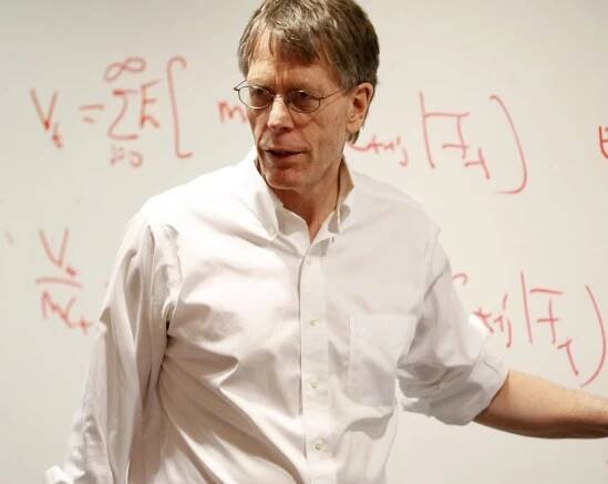 Lars Peter Hansen teaches Advanced Econ in front of a whiteboard