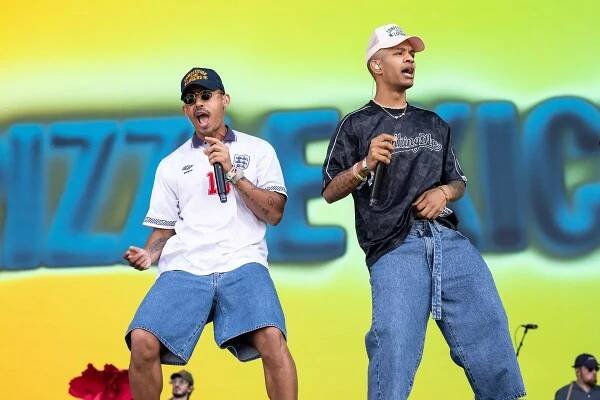 Jordan Stephens and Harley Alexander-Sule of Rizzle Kicks on stage at Glastonbury 2025.