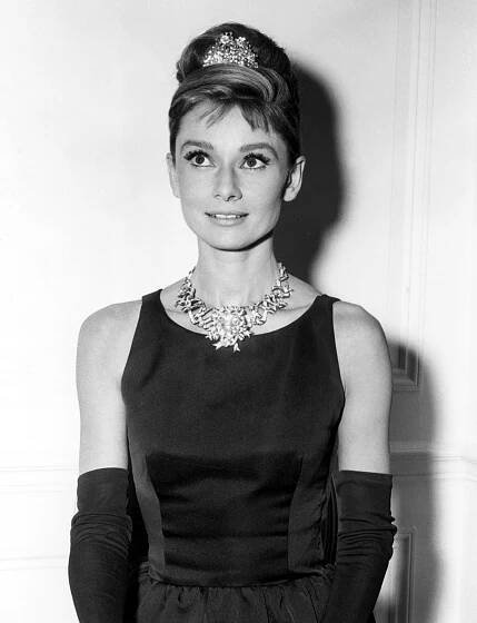 Audrey Hepburn modeling Tiffany & Co.’s canary yellow diamond necklace for her film Breakfast at Tiffany’s, New York, 1960.