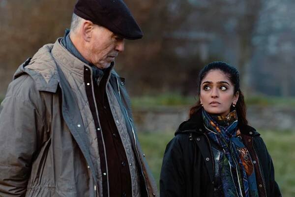 Pierce Brosnan as Conrad Harrigan and Mandeep Dhillon as Seraphina Harrigan in MOBLAND, episode 3, season 1