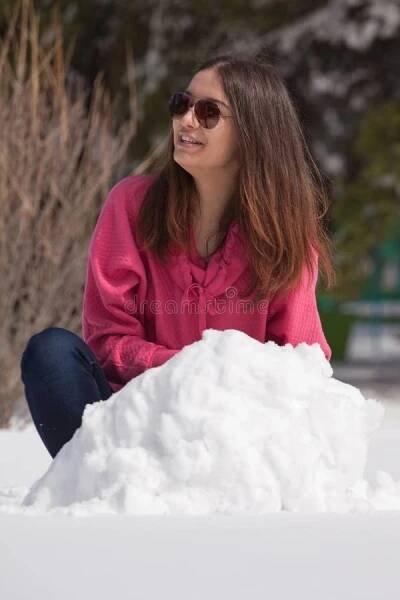 Attractive woman in snow stock images