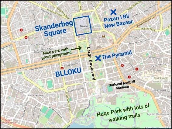 A map of central Tirana, Albania, highlighting Skanderbeg Square, Blloku, the New Bazaar, the Pyramid, a national football stadium, a large park, and a playground; major streets and landmarks are labeled.