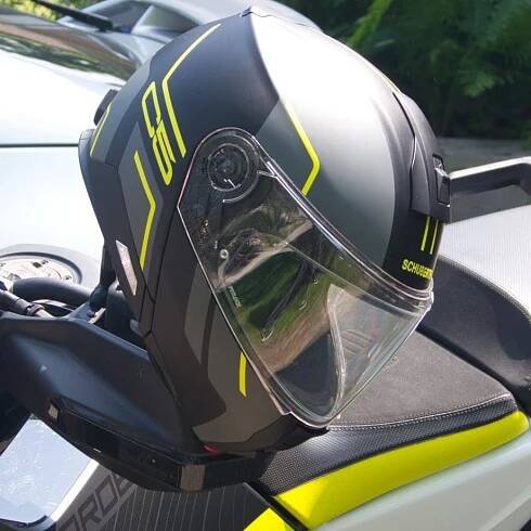 Schuberth C5 Helmet hanging from motorcycle handlebar